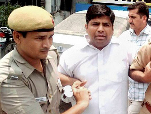 Police detain AAP MLA Dinesh Mohaniya in New Delhi on Saturday for allegedly misbehaving with a group of women who had gone to him to complain about water crisis. PTI Photo