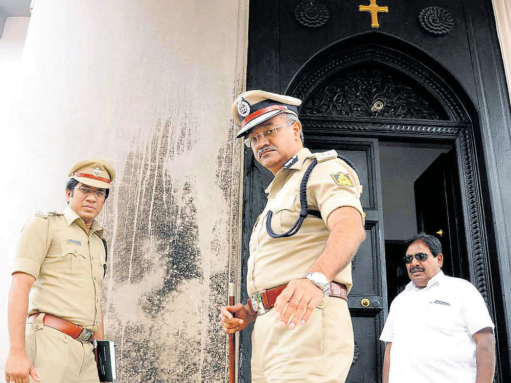 IGP (central range) Seemanth Kumar Singh (right) inspects Tomlinson Church in Tumakuru on Thursday. Superintendent of Police Karthik Reddy looks on. DH photo
