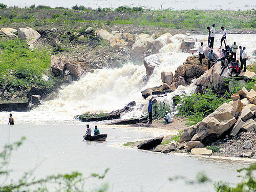 The backwaters of Almatti reservoir flow into a quarry near a cement factory in Bagalkot  on Friday, creating a small waterfalls. DH&#8200;Photo