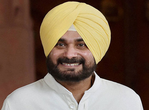 Navjot Singh Sidhu comes out of Parliament House after resigning from Rajya Sabha as Member of Parliament, on the first day the Monsoon Session in New Delhi on Monday. PTI Photo