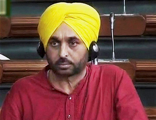 Aam Aadmi Party MP Bhagwant Mann in Lok Sabha during monsoon session of Parliament on Friday. Mann was criticised by all political parties for uploading a live video of Parliament on Facebook. PTI Photo/ TV grab