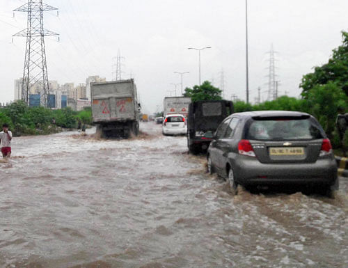 Water logging looks like flood at Golf course extension road in Gurgaon on Saturday.PTI Photo