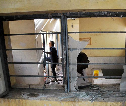 The broken window panes after a blast in a toilet of a court in Mysuru on Monday. PTI Photo