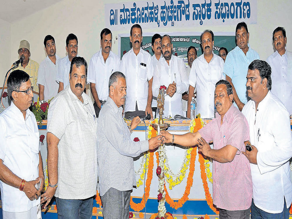 DCC Bank President S L Dharme Gowda, Vice President H K Dinesh and directors inaugurate the bank's annual general body meeting in Chikkamagaluru on Friday. DH photo