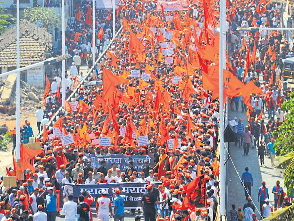 People from the Maratha community participate in 'Maratha Kranti Morcha' in Belagavi on Thursday. DH Photo