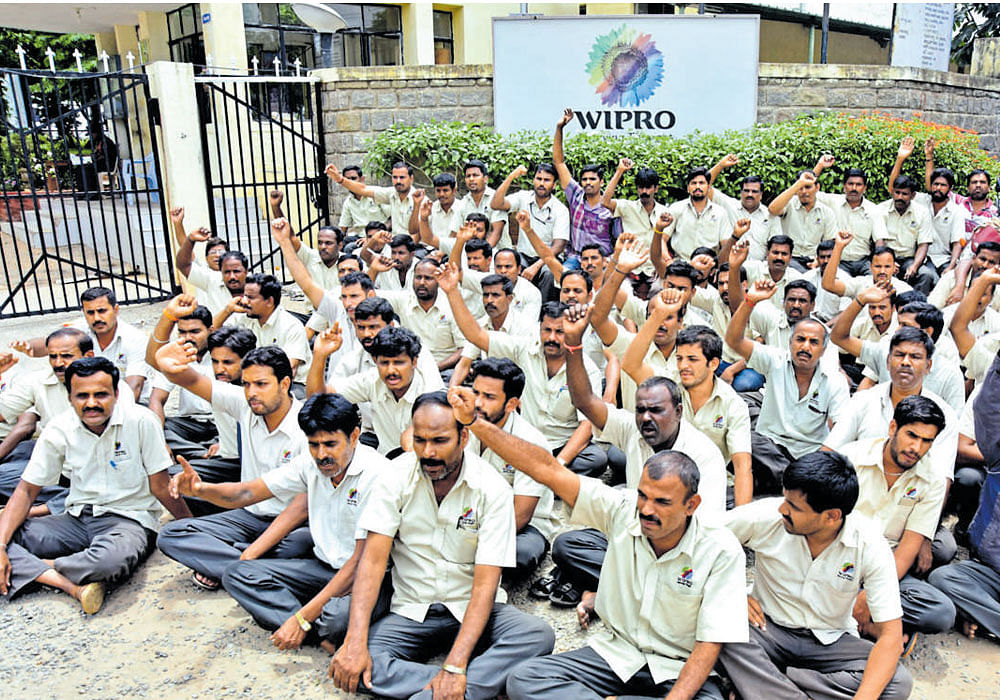 Employees of Wipro Consumer Care and Lighting stage a protest against the lockout of the company at Hootagalli Industrial Area in Mysuru on Tuesday. DH photo
