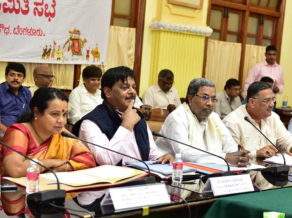 Chief Minister Siddaramaiah presides over a high-level committee meeting convened to make preparations for Mysuru Dasara in Bengaluru on Monday. Ministers Umashree,  H C Mahadevappa and Tanveer Sait look on. DH photo