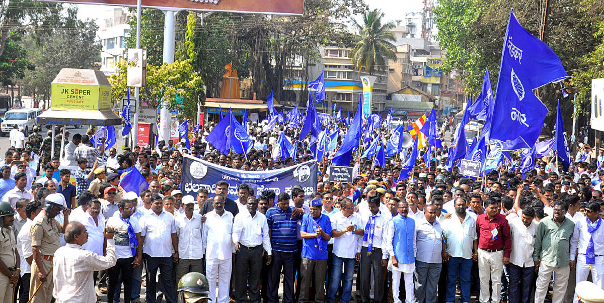 Dalit activists take out a protest rally in Belagavi on Wednesday, against atrocities on community members. dh photo
