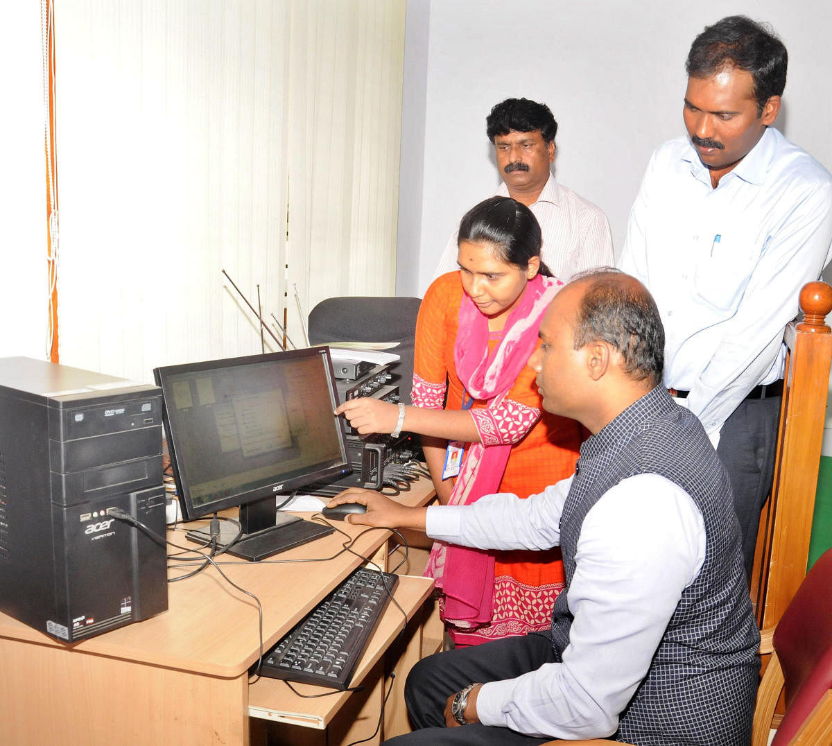 Deputy Commissioner D Randeep inaugurates the e-office facility at Mysuru taluk office, at the Mini Vidhana Soudha in Nazarbad, Mysuru on Monday. Additional Deputy Commissioner T Yogeesh and Tahsildar Ramesh Babu are seen.