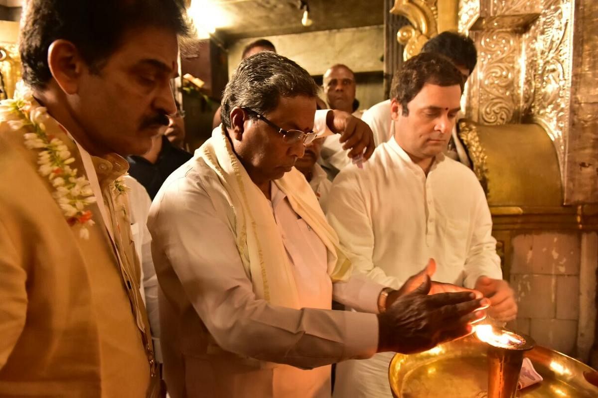 AICC president Rahul Gandhi takes darshan of Goddess Chamundeshwari in Mysuru on Saturday. Chief Minister Siddaramaiah, AICC General Secretary and party in-charge for Karnataka K C Venugopal are also seen. DH PHOTO