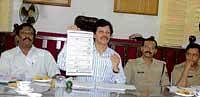 Geared up: Deputy Commissioner N Prabhakar displaying a model ballot paper at a poll preparedness meeting in Kolar on Tuesday. Election Observer  N Babanna, Kolar and KGF Superintendents of Police Dr K Tyagarajan and Devajyoti Rai are seen. DH PHOTO