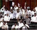 TV GRAB:  Members disrupt the proceeding in the Lok Sabha in New Delhi on Wednesday. PTI