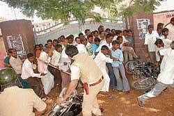 Police resorted to mild lathi charge to disburse the mob outside the STJ College where counting was held. dh photo
