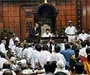 Karnataka Chief Minister presents a bill amids ruckus in the legislative assembly in Bangalore on Friday. PTI