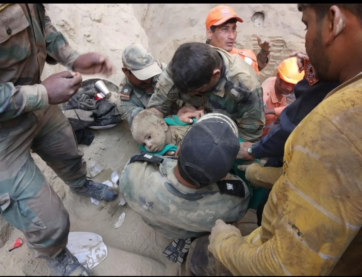 First image of 18 months old boy rescued from a 60 feet deep borewell in Haryanas Hissar on Friday. DH photo
