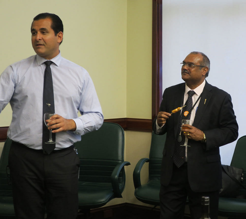 Shahyaz Yezdi Mubarakai (left) and Kevin Michel, Indian-born MLAs in the Western Australian Parliament, in conversation with a delegation of Indian journalists. Credit: DH Photo/Furquan Moharkan