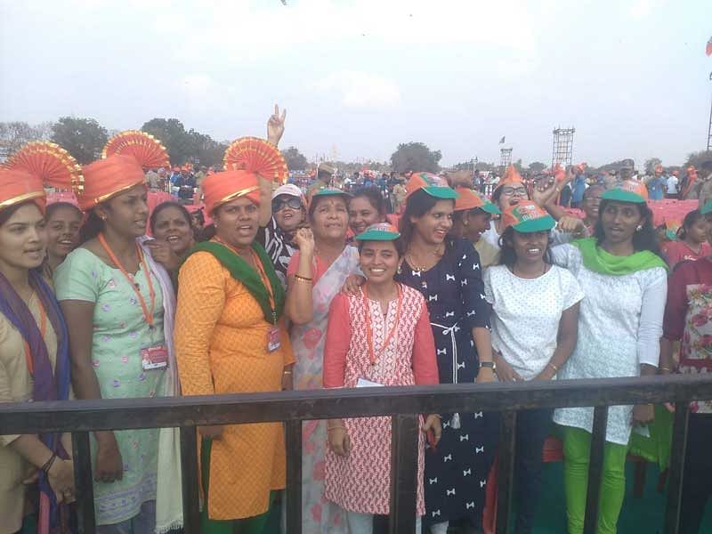 Women cheer at PM Narendra Modi campaigning rally venue in Hubballi. (DH Photo)