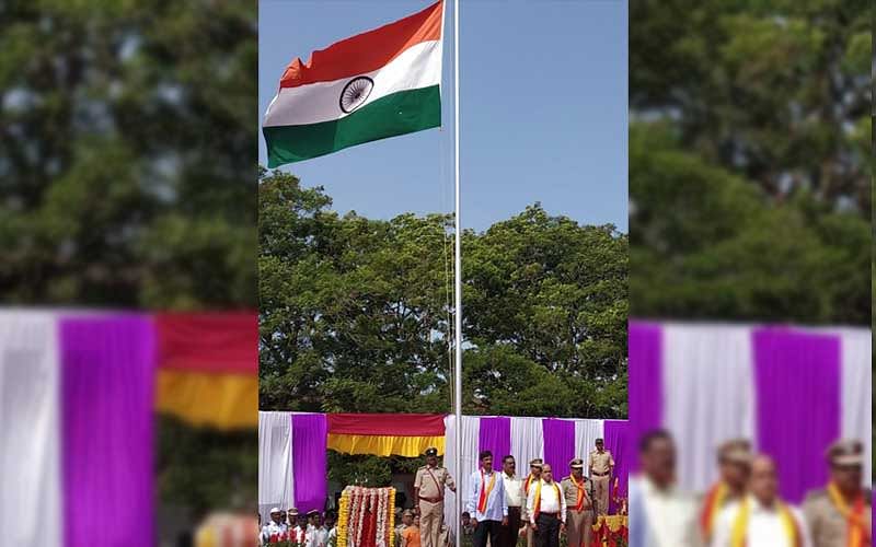 Municipal Administration and District Incharge Minister Ramesh Jarkiholi hoisting the national flag during the Kannada Rajyotsava celebrations in Belagavi on Thursday. (DH Photo)