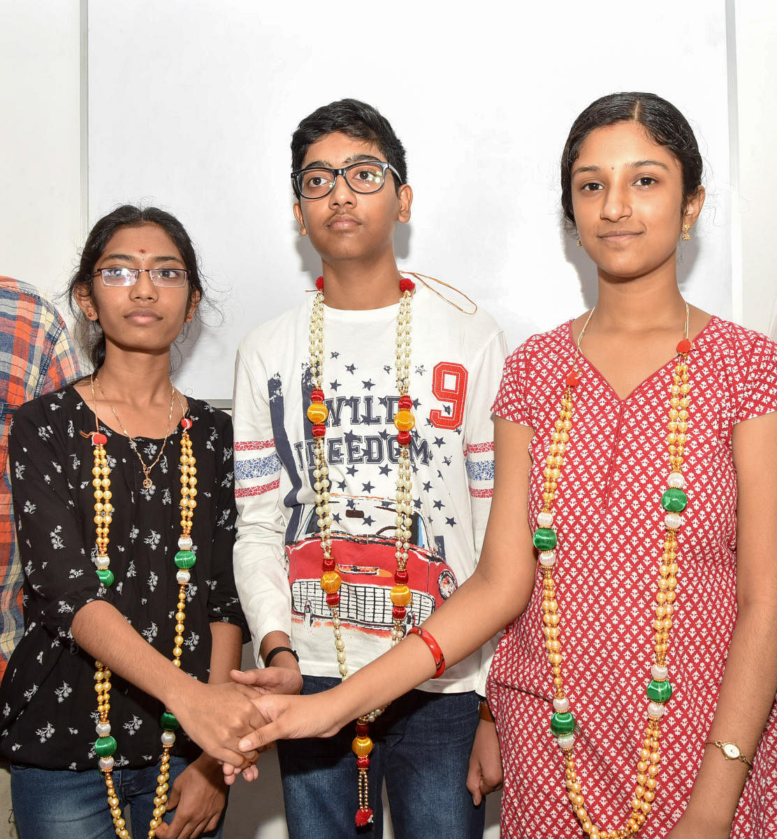 R Keerthana, M S Yashas and Adithi A Rao, students of Sadvidya High School, in Mysuru on Monday.