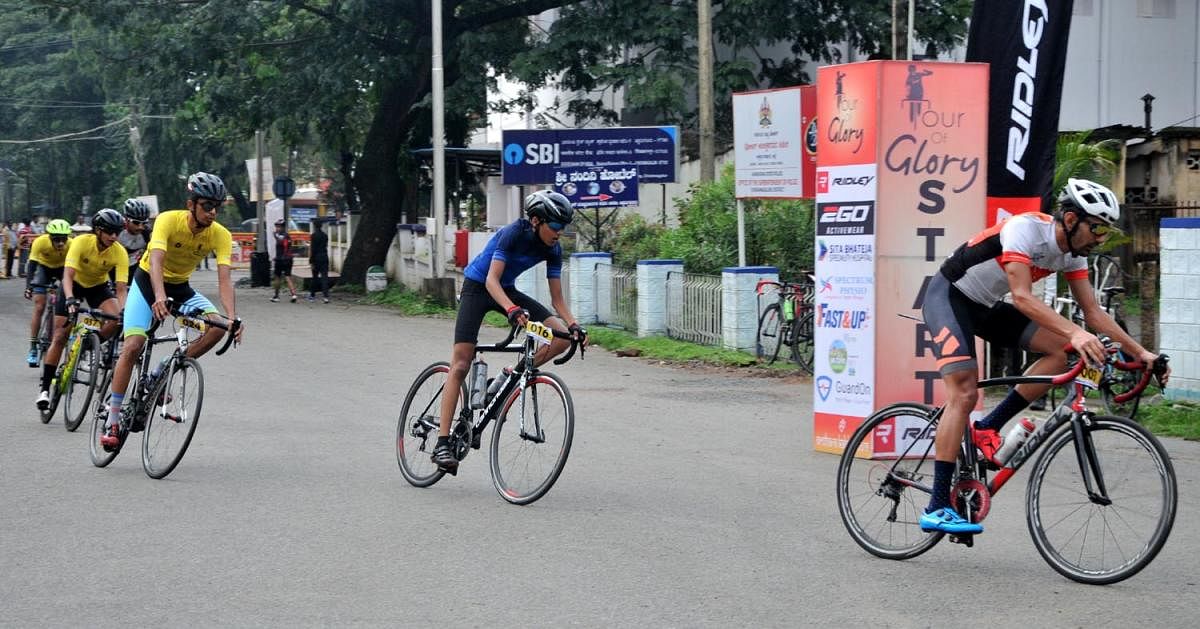 Cyclists pass through SP office in Chikkamagaluru.