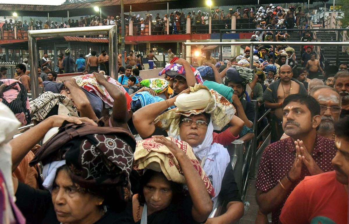 Devotees arrive to pay obeisance at Lord Ayyappa Temple in Sabarimala, Thursday, October 18, 2018. PTI