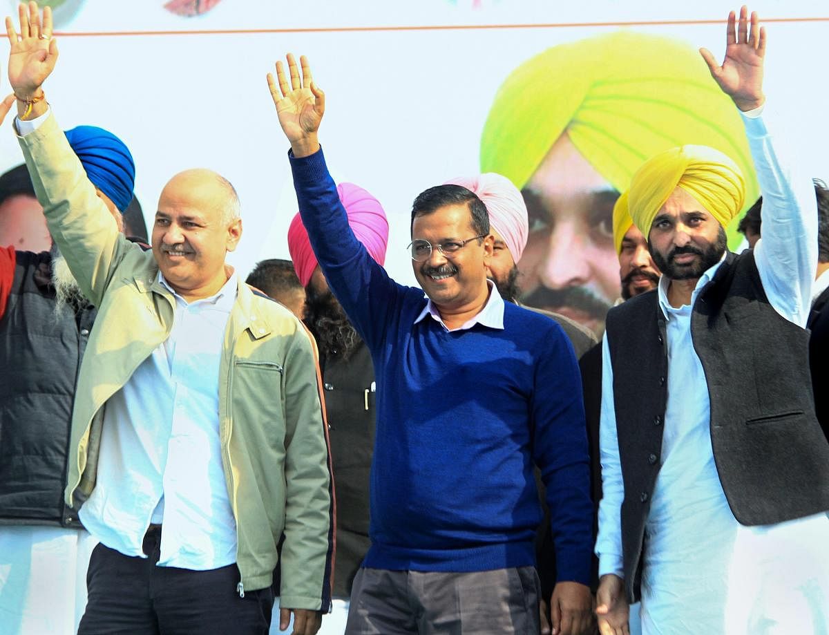 Aam Aadmi (AAP) convener and Delhi CM Arvind Kejriwal, his deputy Manish Sisodia and party MP Bhagwant Mann during a rally in Barnala, Sunday, Jan 20, 2019. (PTI Photo)