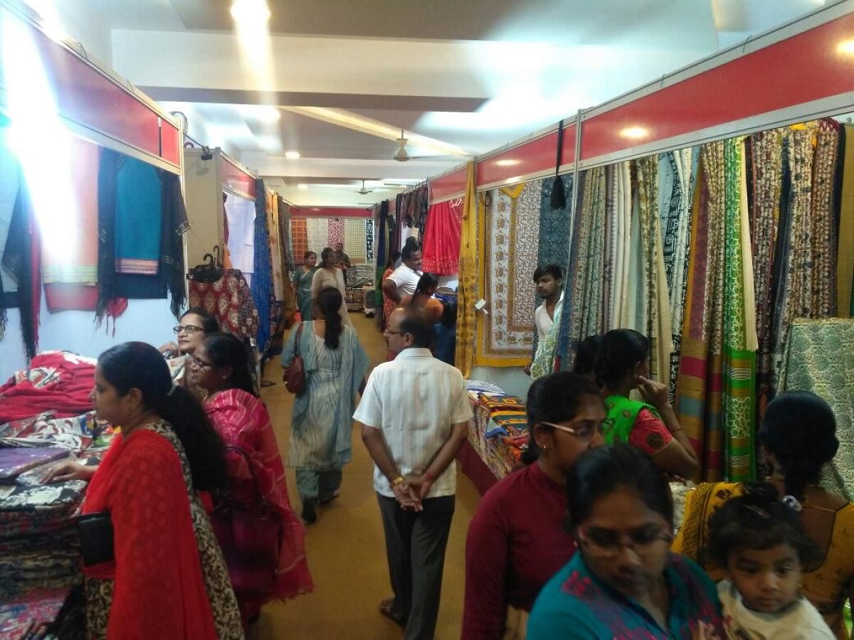 Customers take a look at the wares on display at Kala silk exhibition in Chikkamagaluru.