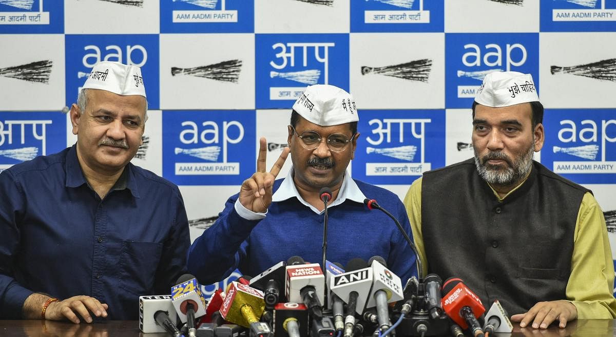 Delhi Chief Minister Arvind Kejriwal flanked by his Deputy Chief Minister Manish Sisodia (L) and AAP leader Gopal Rai addresses the media, in New Delhi. PTI photo