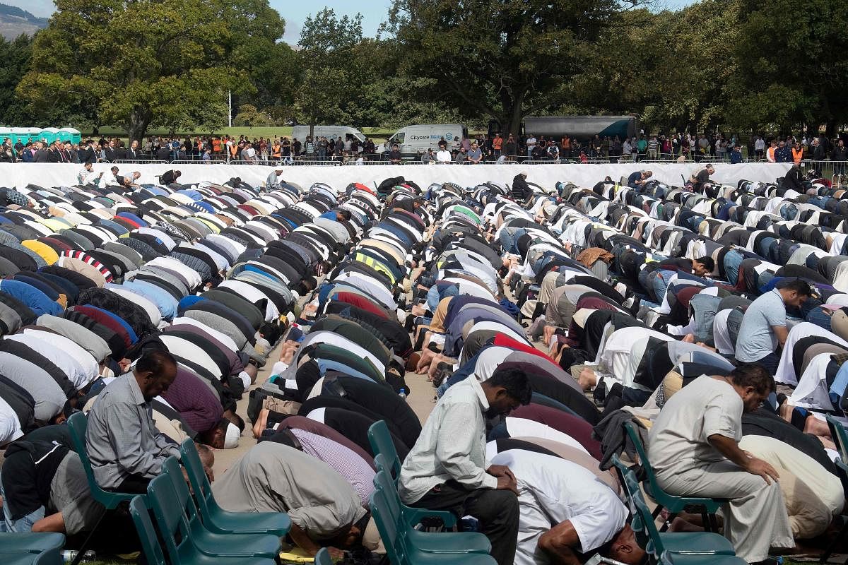 Muslims prostrate towards Mecca during congregational Friday prayers led by Gamal Fouda, imam (lead cleric) of tragedy-stricken Al Noor mosque, during a gathering for prayers and to observe two minutes of silence for victims of the twin mosque massacre at