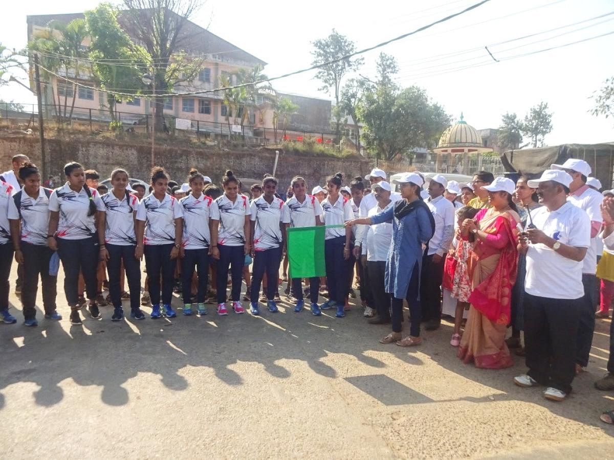 Zilla Panchayat CEO and SVEEP Committee Chairperson K Lakshmi Priya flags off a marathon in Madikeri.