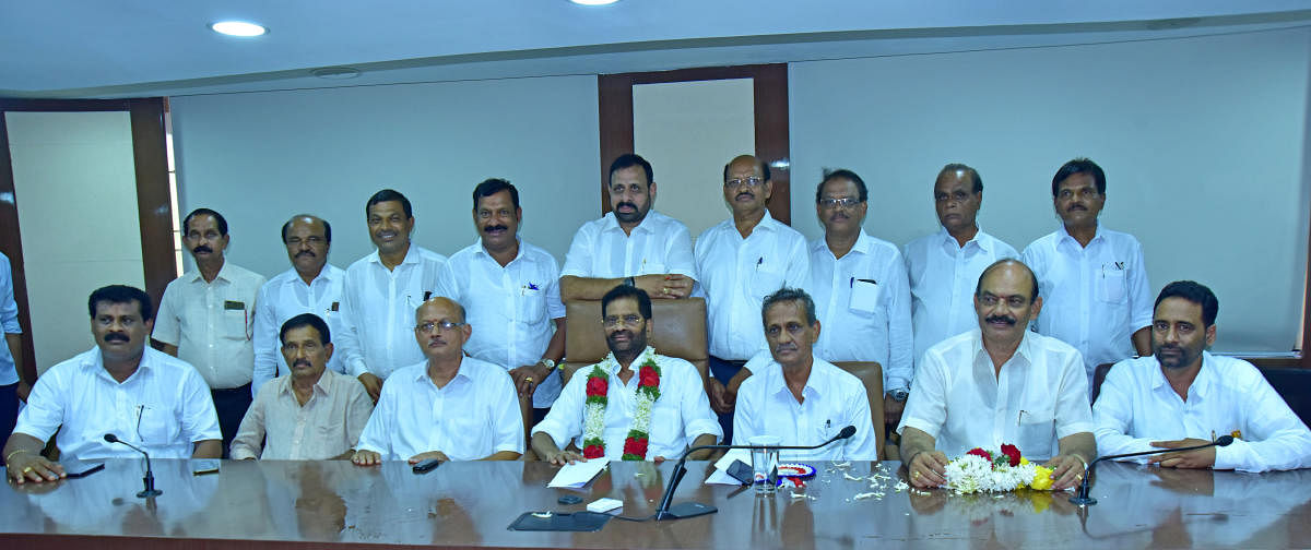 SCDCC Bank President M N Rajendra Kumar and newly elected members seen at meeting hall in Mangaluru. DH Photo