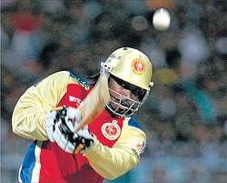 In the mood!: Royal Challengers opener Chris Gayle blasted his way to a 55-ball hundred and powered his team to a nine-wicket win over Knight Riders. PTI