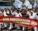 DYFI workers shout slogans during a protest march demanding ban on endosulfan in Kanur on Monday. PTI Photo