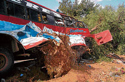 Fatal: The private bus which hit a tree in Chitradurga taluk on Monday. DH Photo