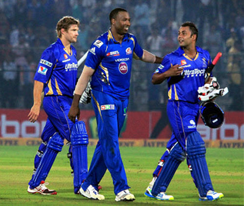 Rajasthan Royals players Stuart Binny and Shane Watson after their win against Mumbai Indians during the Champions League T20 match at SMS stadium in Jaipur. PTI File Photo