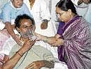 TRS president K Chandrashekar Raos wife offer him juice to break his hunger strike at NIMS in Hyderabad on Wednesday night. PTI