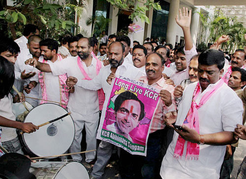 TRS workers celebrate their win in Lok Sabha polls at the party office in Hyderabad on Friday. PTI Photo