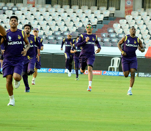 Kolkata Knight Riders players during a practice session ahead of an IPL 7 match. PTI Image