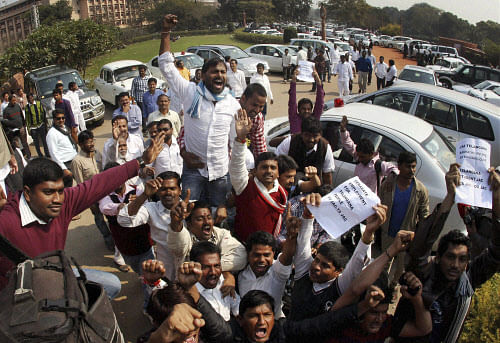 Enraged farmers took to the streets, protesting against the Telangana Rashtra Samithi (TRS) government's announcement that only those loans taken during 2013-14 and are under Rs 1 lakh would be waived, after a heartbroken farmer died in the chief minister's native district of Medak while watching the announcement on television. AP file photo