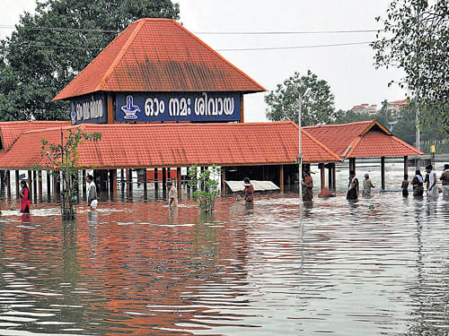 The Aluva Siva Temple is submerged in flood water after heavy rain in Kochi on Monday. PTI