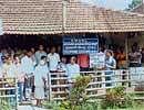 Members of the CPI Kalasa unit staging a dharna in front of Veterinary Hospital in protest against the authorities for allegedly making partiality while selecting beneficiaries under Vidarbha package. DH photo