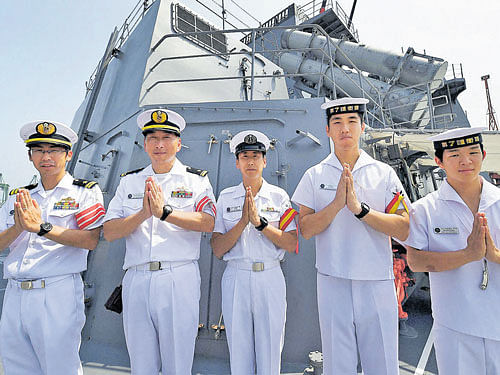 Naval officers of Japan Navy greet onlookers during themedia visits of six-day 'Malabar exercise' at the Port Trust in Chennai on Thursday. PTI