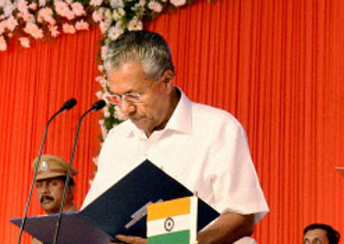 Kerala Governor P Sathasivam administers oath to Pinarayi Vijayan as the new Chief Minister of the state in Thiruvananthapuram on Wednesday. PTI Photo