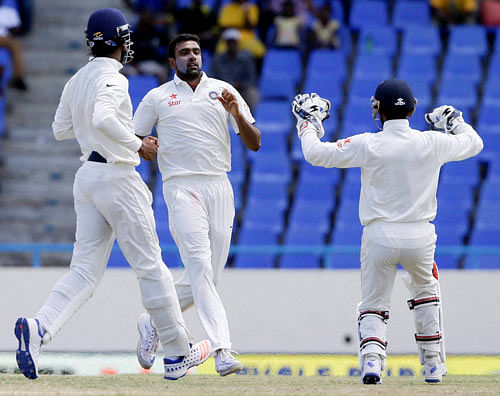 India's bowler Ravichandran Ashwin center celebrates with teammates after he bowled out West Indies' Marlon Samuels during day four of their first cricket Test match at the Sir Vivian Richards Stadium in North Sound, Antigua, Sunday, July 24, 2016. AP/PTI