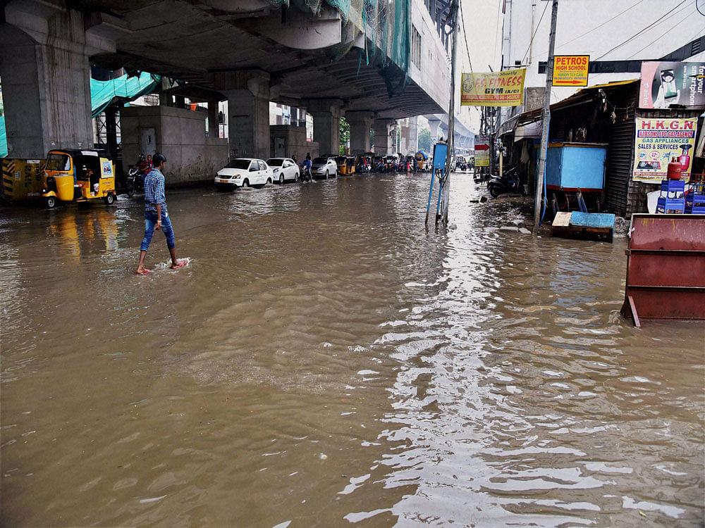 Some of the low lying areas in Hyderabad are still cut off from the rest of the city, even as Greater Hyderabad Municipal Corporation (GHMC) and some NGOs are offering essential food items such as milk towards relief of those affected. PTI photo