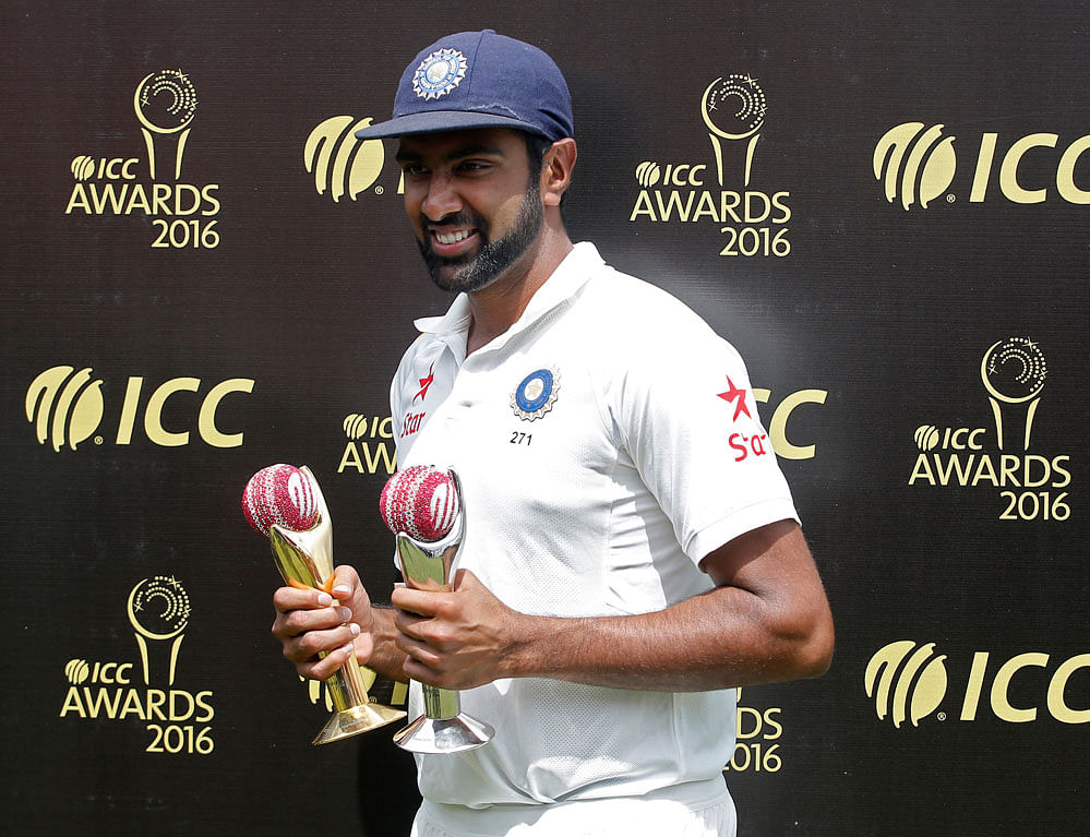India's Ravichandran Ashwin, who won the International Cricket Council's (ICC) Cricketer of the Year and Test Cricketer of the year award, poses with the trophies during the award ceremony. REUTERS