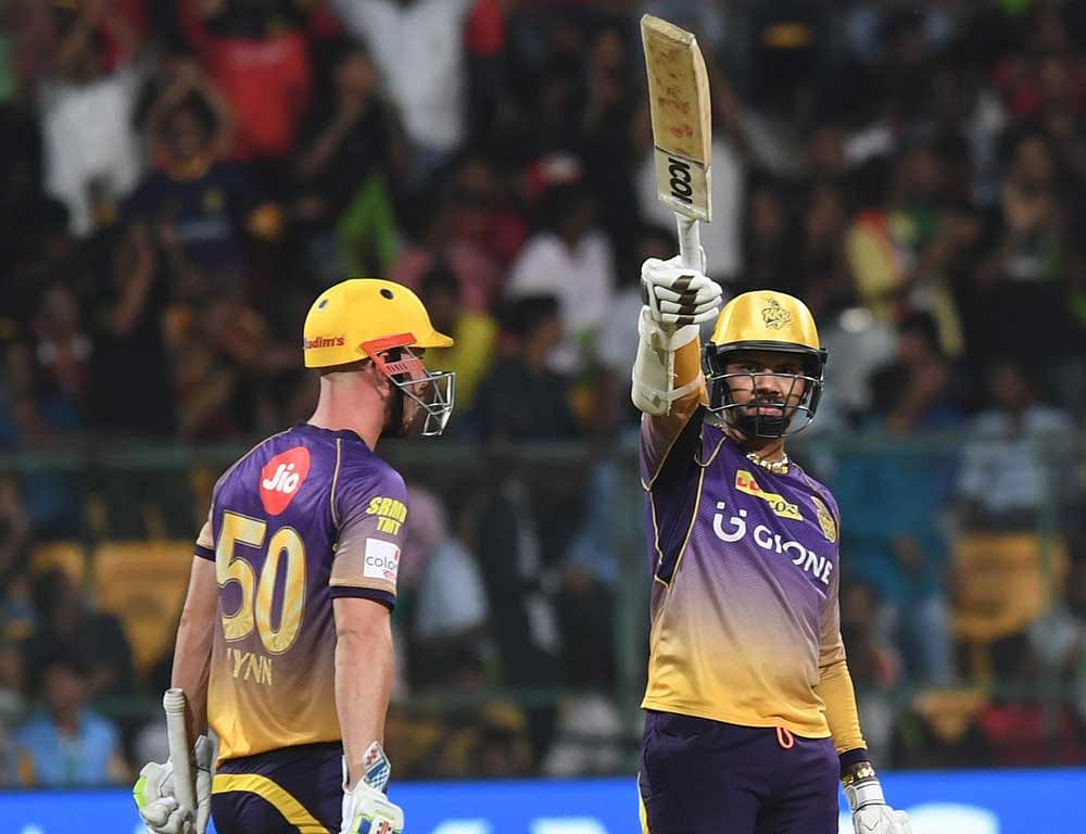 Sunil Narine of KKR acknowledge the crowd after his half century against RCB during bowling the IPL match at Chinnaswami Stadium in Bengaluru on Sunday. DH PHOTO by Kishor Kumar Bolar
