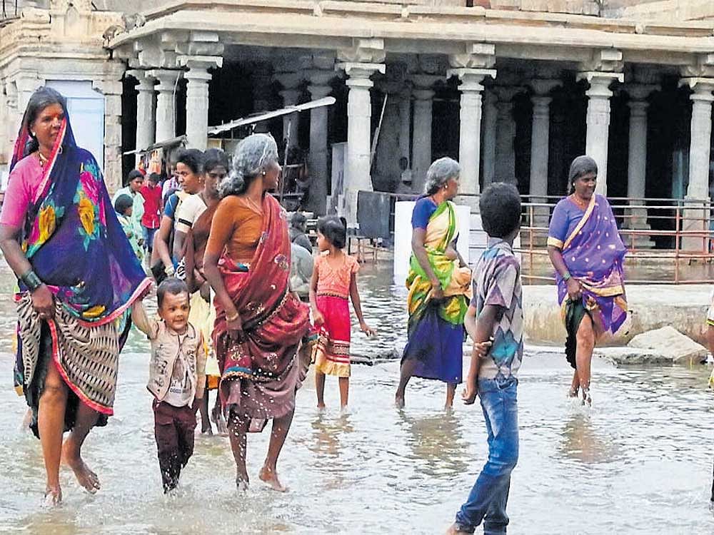 The premises of Virupaksha temple at Hampi in Ballari district was flooded following  heavy rain on Friday. DH photo