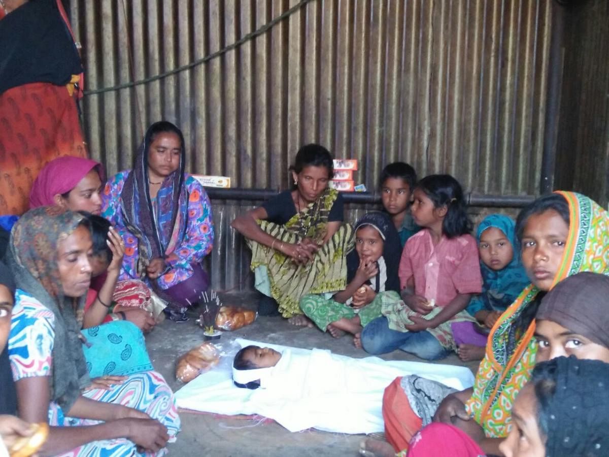 The family members and relatives grieve the death of 1-year-old Bhanu, who reportedly died due to freezing cold, at a makeshift tent near Kandavara on the outskirts of Chikkaballapur on Saturday.