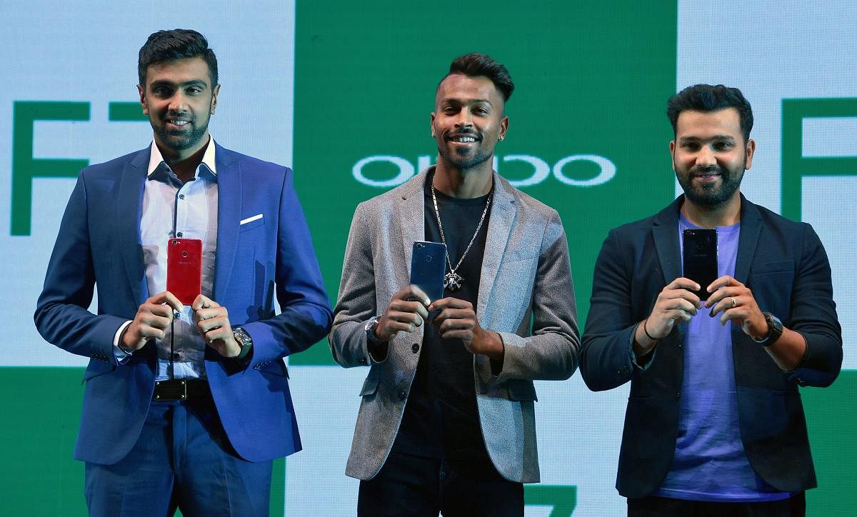 OFF CRICKET Indian cricketers (from left)) Ravichandran Ashwin, Hardik Pandya and Rohit Sharma at a promotional event in Mumbai on Monday. AFP